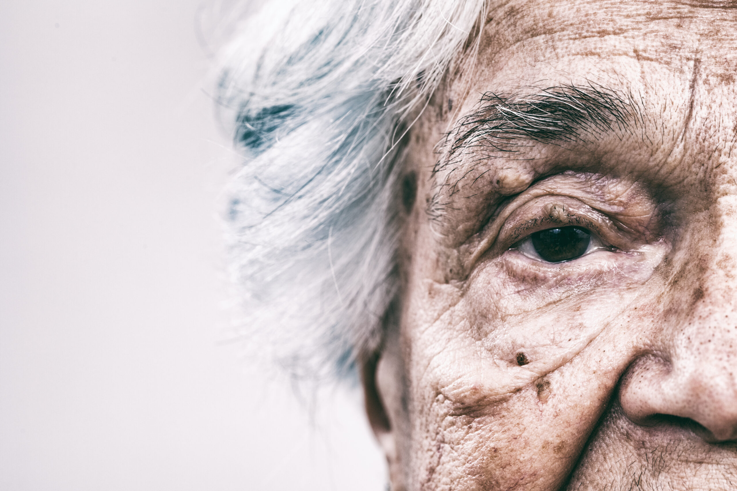 extreme-close-up-of-senior-s-face-with-grey-hair-2026-03-20-02-03-55-utc